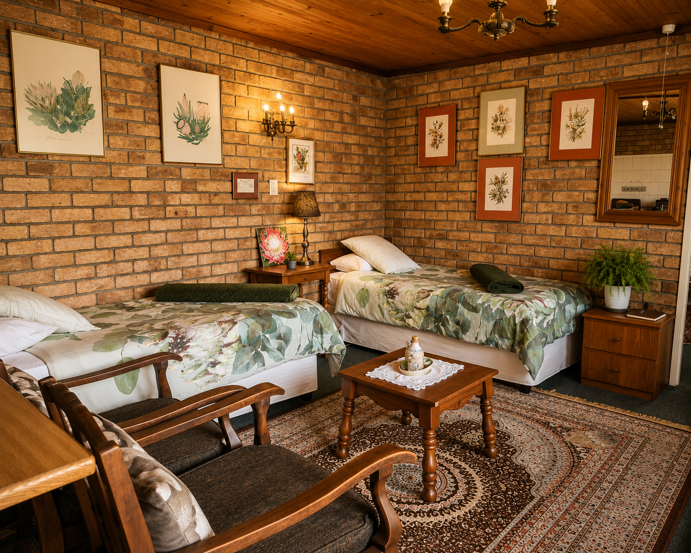 Twin bedroom and sitting area in the Protea Suite with exposed brick walls and botanical decor